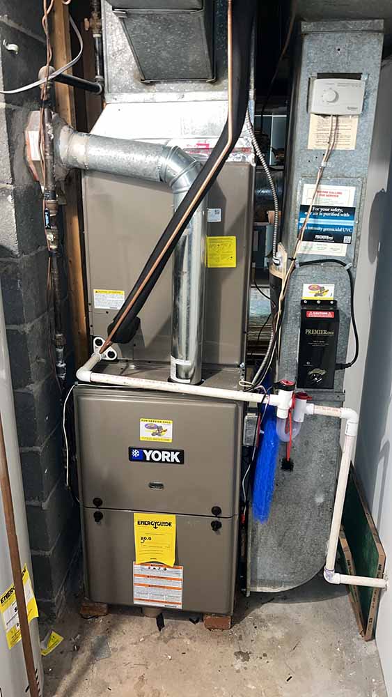 York furnace installation with air ducts and control panel by Jeffrey Burke Plumbing, Heating & Cooling.